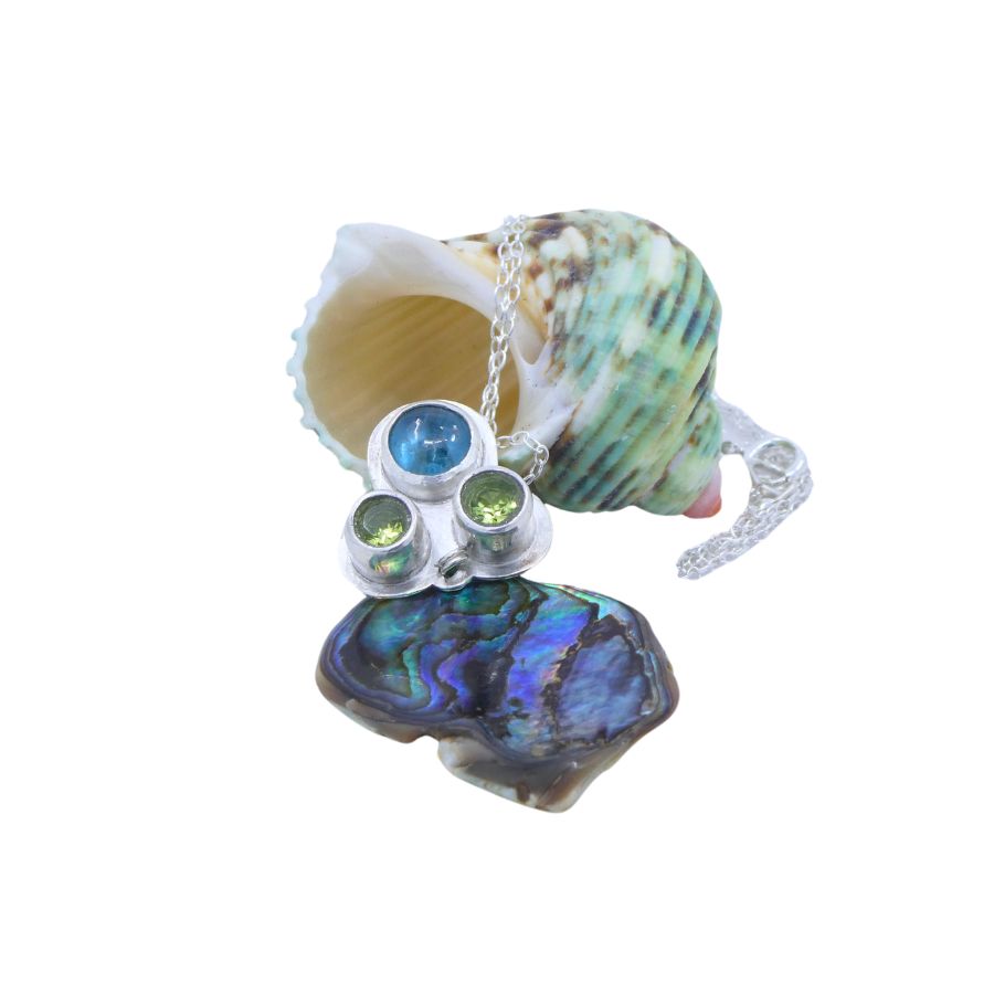 silver pendant with paua shell and kyanite and peridot gemstones