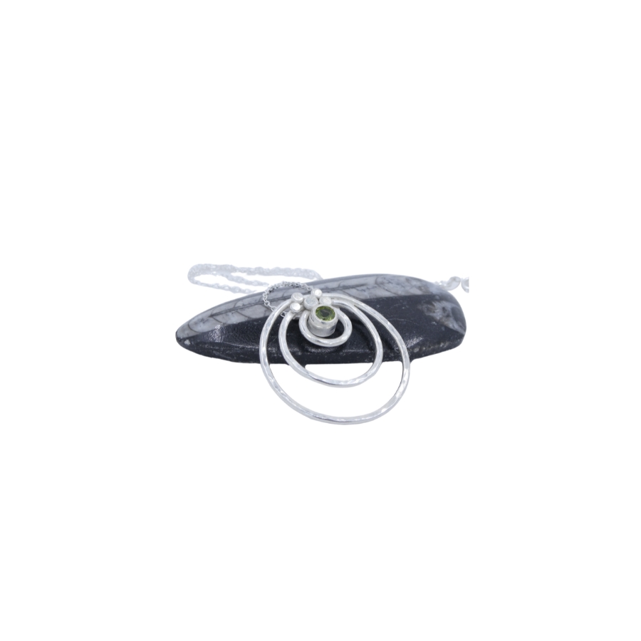 Argentium silver concentric textured circles pendant with peridot