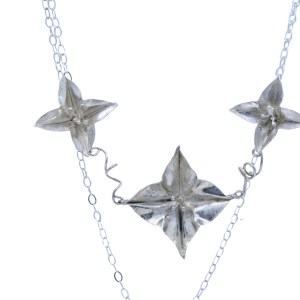 Three medium flower silver necklace