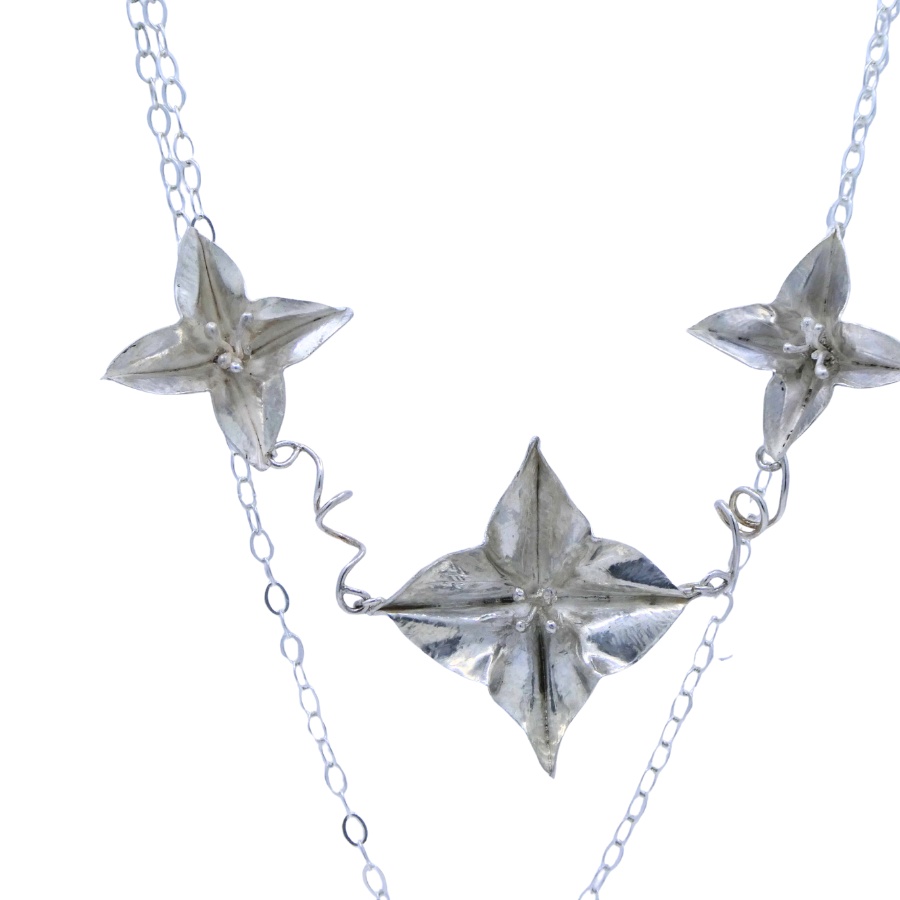Three medium flower silver necklace